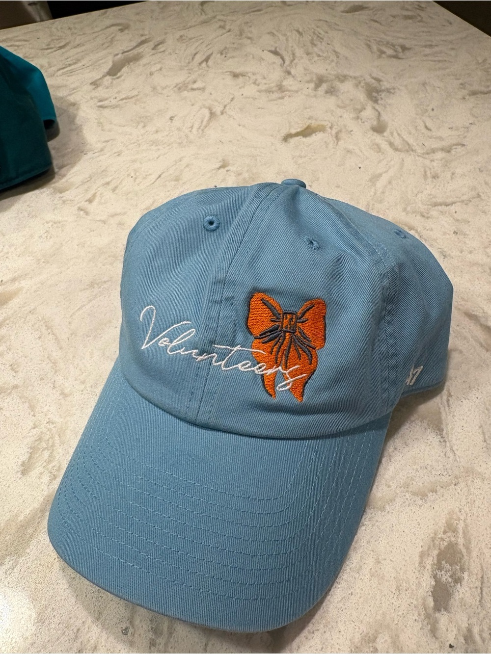Blue 'Volunteers' Embroidered Cap with Orange Bow